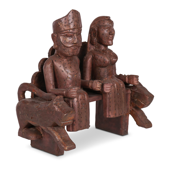 Statue wood man and wife on bench